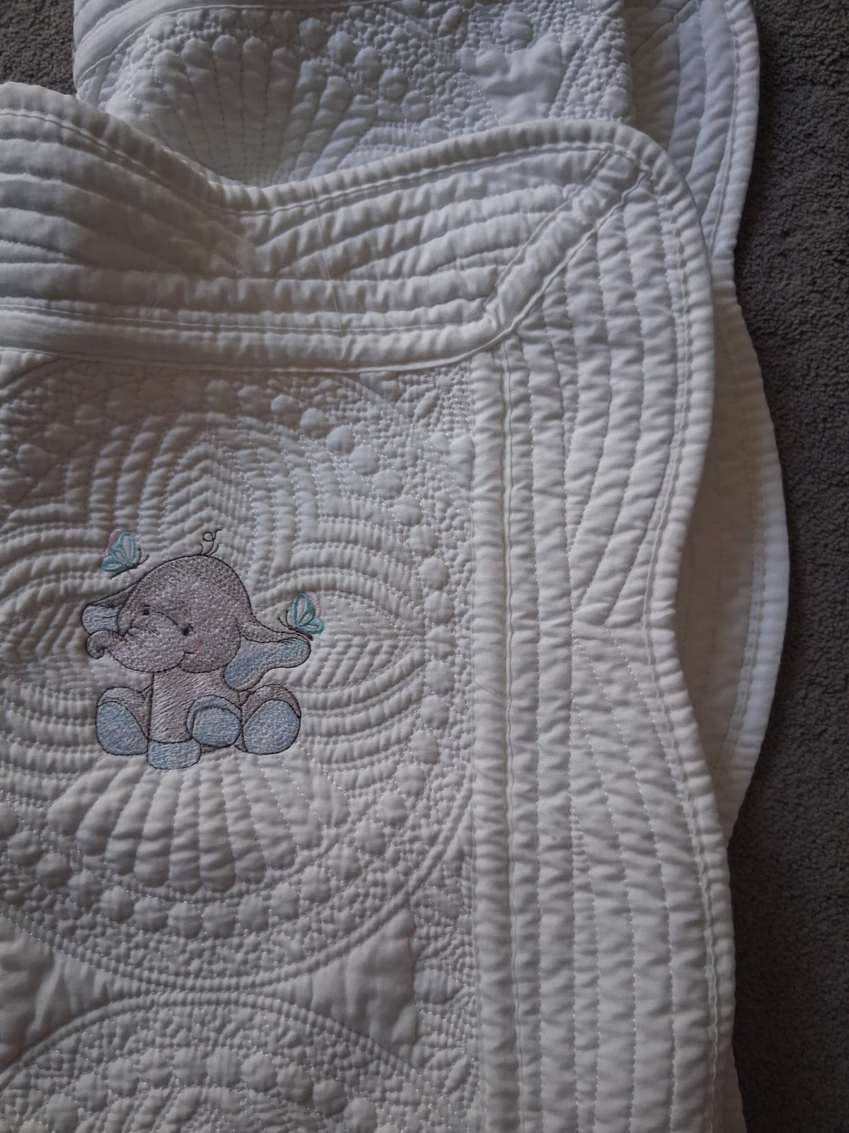 Personalised baby quilt with custom name embroidery